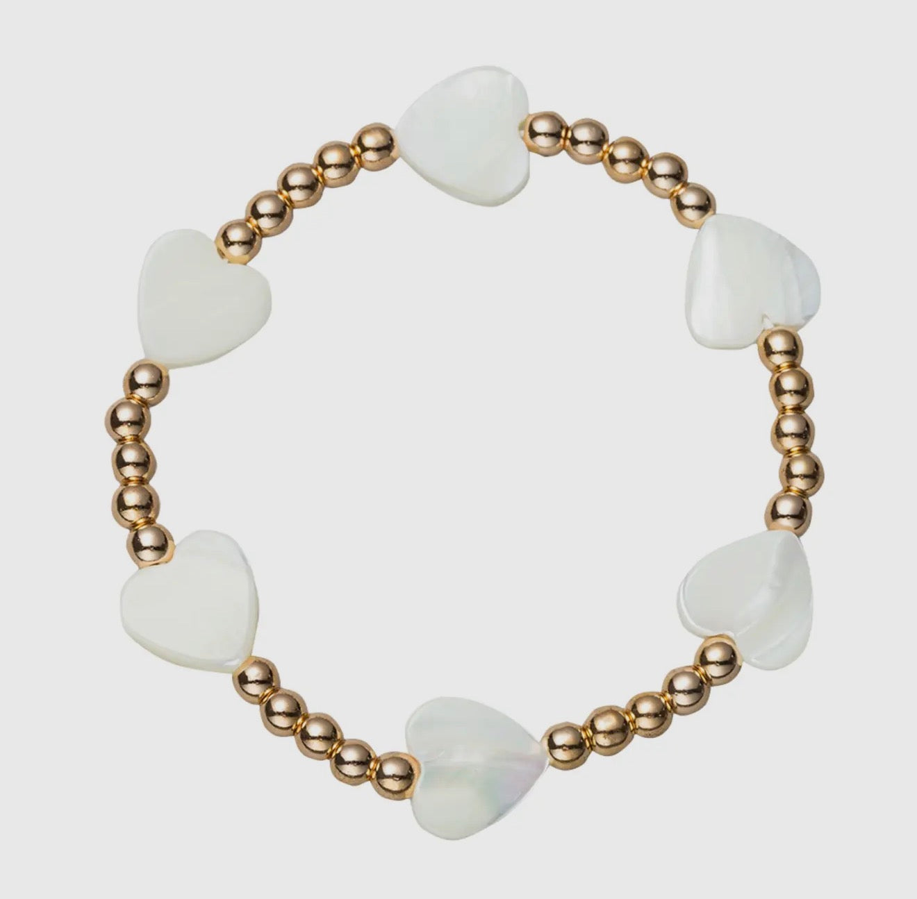 Gold beaded stretch bracelet with shell hearts